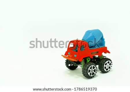 colorful truck cement (concrete) mixer plastic toy isolated on white background