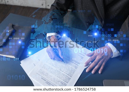 World map and a woman signing papers. Double exposure.