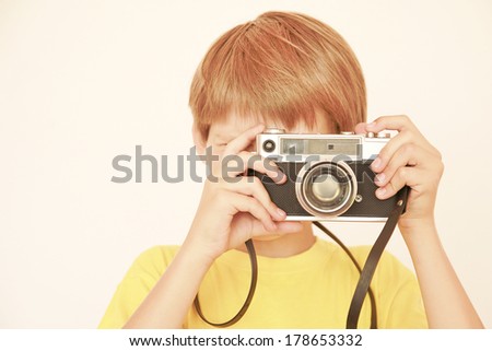 Child with old camera