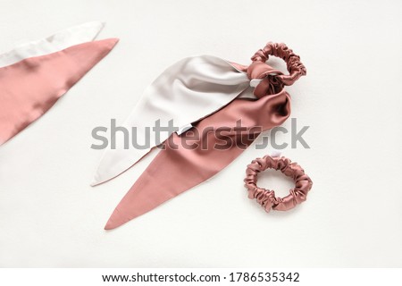 Coral-Pink hair accessories with textile rose. silk Pink Scrunchy isolated on white backdrop. Flat lay Hairdressing tools and accessories for woman - Colorful Hair Scrunchies, Elastic HairBands