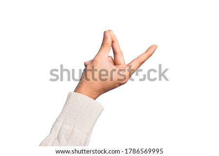 Hand of caucasian young man showing fingers over isolated white background snapping fingers for success, easy and click symbol gesture with hand