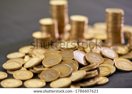 Stock Photo - Euro coins. Euro money. Euro currency.Coins stacked on each other in different positions. Money concept