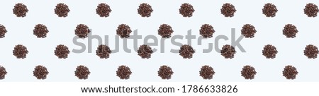 Pattern with coffee beans on a white background. Panoramic photo