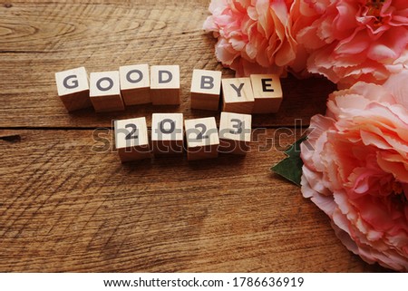 Good Bye 2023 word letter with space copy on wooden background