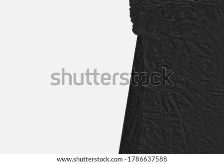 Old black torn paper on white background