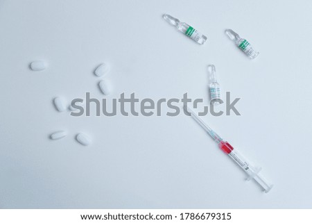 syringe with medicine on a white background