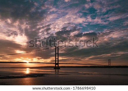 The Sun setting over the Humber Bridge, Yorkshire Royalty-Free Stock Photo #1786698410