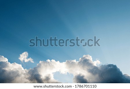 Blue sky with gray clouds.