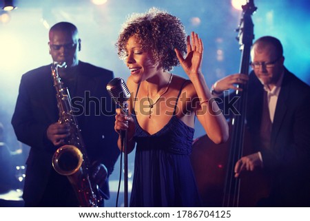 Portrait of Jazz Band playing on Stage Royalty-Free Stock Photo #1786704125