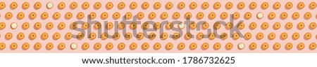 Biscuits stuffed with cream on bright pink background, a recurring seamless pattern, sweet background, wallpaper. Copy space, banner. top view