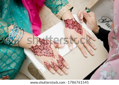 hand henna in the making Royalty-Free Stock Photo #1786761545
