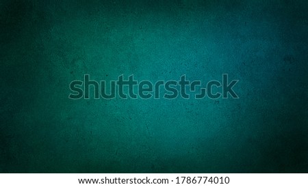 abstract cyan and green architecture wall material. blank concrete wall texture surface background with dark corners.