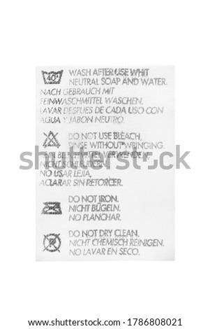 Textile care clothing label in different languages isolated over white