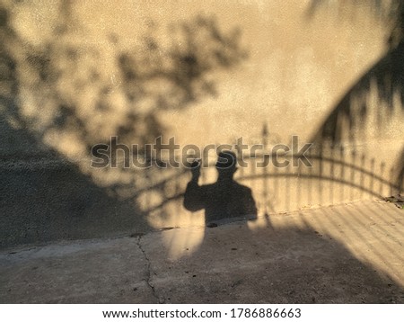 Shadow of man touching the gate. Liberation Concept.