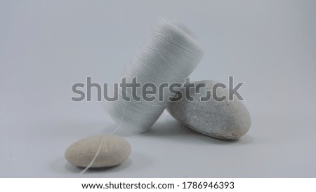 White sewing thread with white stones