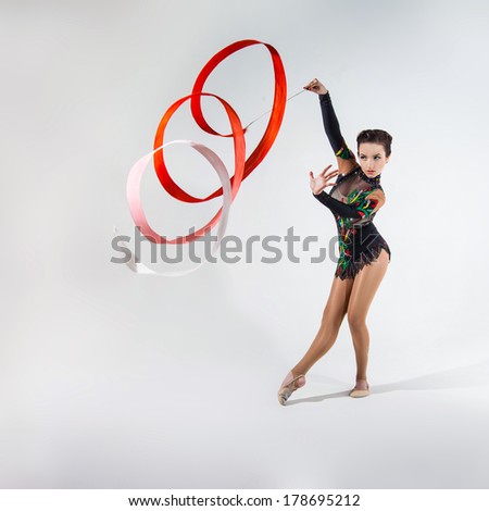beautiful girl dancing with gymnastic ribbon