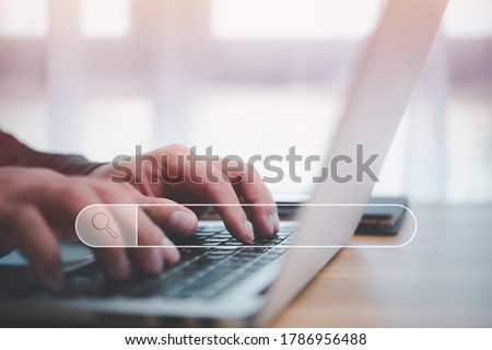 Data Search Technology Search Engine Optimization. man's hands are using a computer notebook to Searching for information.Using Search Console with your website. Royalty-Free Stock Photo #1786956488