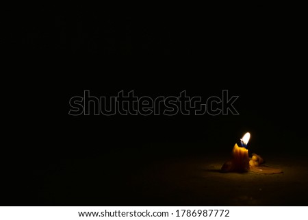 One light candle brightly in a dark night