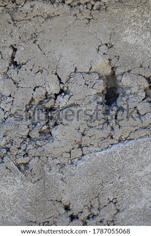 Rough texture of cement mortar on a stone wall.