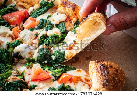 tasty pizza in the box