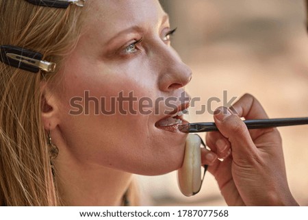 Makeup artist working during photo shoot