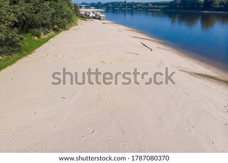 summer drought on the river and low water on the banks italy europe