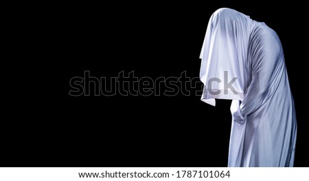 People are in white clothes and appear scary, look like ghost in night isolated on black background, Halloween Festival concept, Copy space ,with clipping path