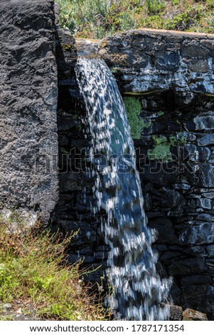 A freshwater fall on a stone wall