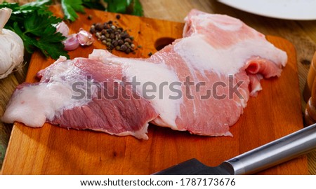 Image of raw pork with greens and spice before cooking, nobody