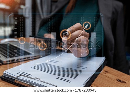 Double exposure of businesswoman working on tablet and hand touching  business financial virtual chart, Digital network marketing concept, Background toned image blurred.