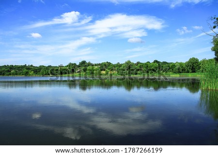 Beautiful river in a pretty area in Siberia. Landscape in Canada with a cold lake. Stock photo background.