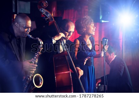 Jazz Band playing on Stage Royalty-Free Stock Photo #1787278265