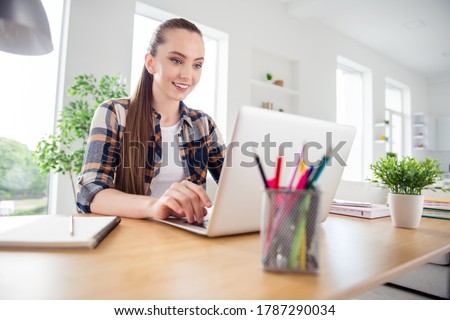 Photo of young pretty student browsing laptop notebook sitting table desktop video call listen teacher lesson online conference education concept social distance quarantine indoors