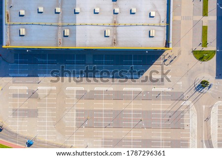 Huge shopping mall of household goods with a lot of parking space, aerial view