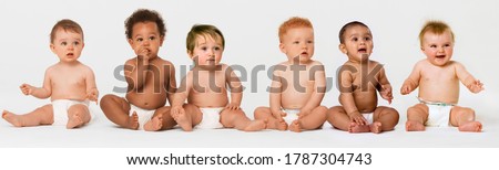 Row of six multi ethnic Babies smiling in studio Royalty-Free Stock Photo #1787304743