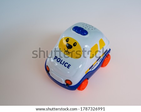 Cartoon police car toy isolated white background.