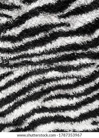 close up photograph of zebra textured carpet 