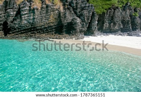 clear blue water and white sand