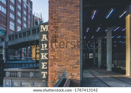 Market neon sign seen from High Line in Chelsea. New York City. The market has lots of stores, restaurants and food markets. Royalty-Free Stock Photo #1787413142