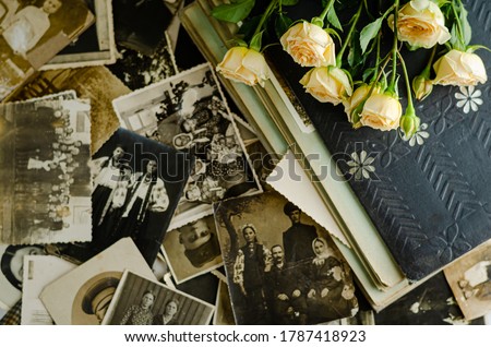 Vintage photo album with family photos. Life values and generations concept.