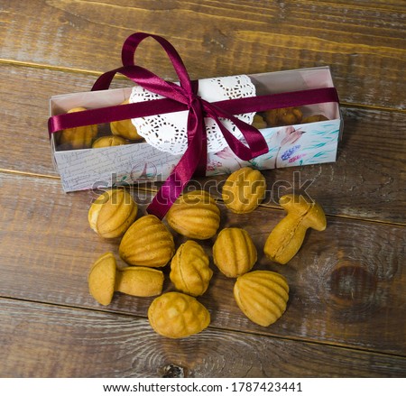 Retro sweets with caramel on wood in gift box