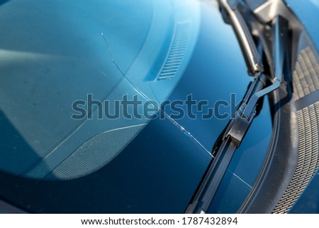 Stone damage, or stone-chip on a windshield on a car Royalty-Free Stock Photo #1787432894