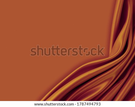 Beautiful elegant wavy brown satin silk luxury cloth fabric texture with abstract monochrome background design. Copy space.