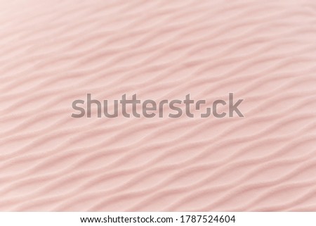 Disfocused soft blurred pale pink rib waves fabric texture background