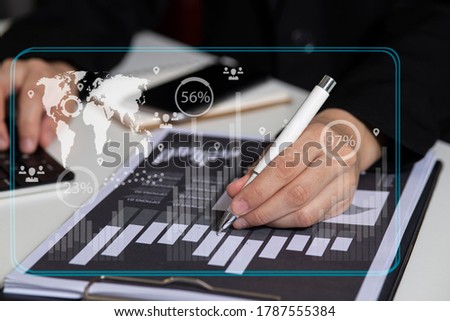 Double exposure of businessman working on digital tablet or smart phone with digital marketing virtual chart, Abstract icon, Business strategy concept, Soft focus.
