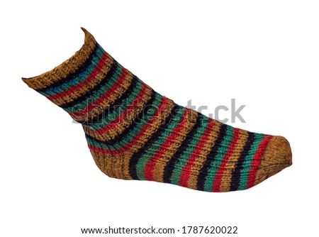 woolen yellow,black,turquoise,red striped socks isolated on a white background. winter accessories.socks top view
