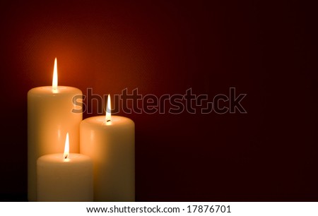 Three candles on a red background Royalty-Free Stock Photo #17876701
