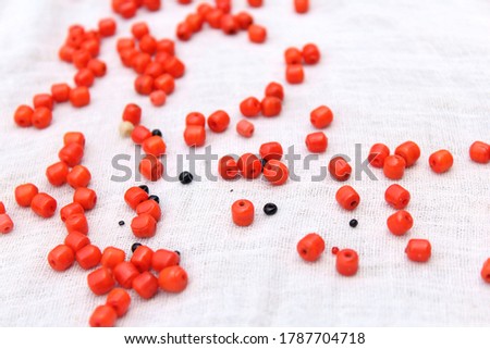 some red and black stone pearl isolated on white background