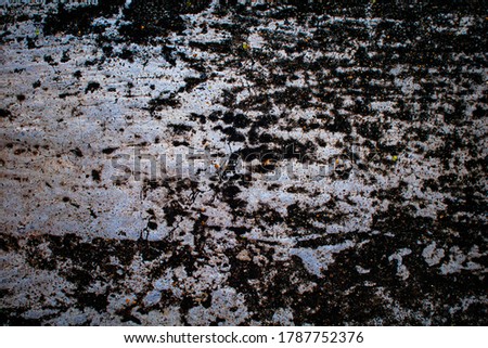 Beautiful abstract black spotted, rough stone cement wall background image in warm and cold mood with fine texture. Pantone of the year color concept background banner with space for text.