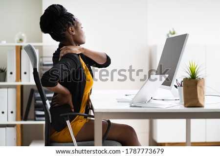 Back Pain Bad Posture Woman Sitting In Office Royalty-Free Stock Photo #1787773679